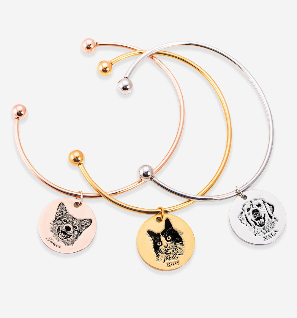 Three stylish Pet Face Bangles featuring custom pet portraits on gold, silver, and rose gold bases