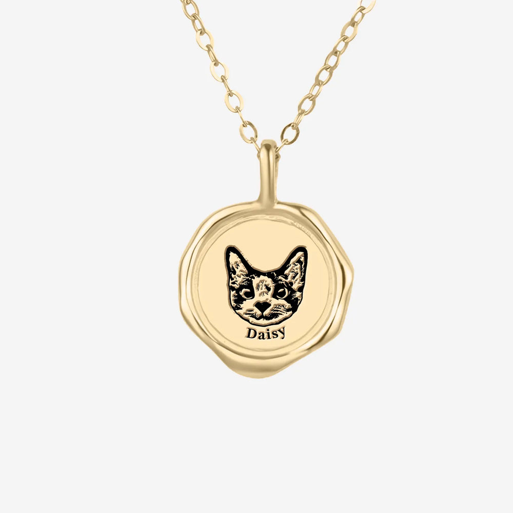 Personalized gold Pet Portrait Necklace featuring a cat engraving and the name Daisy