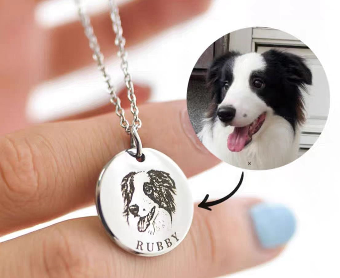 Close-up of a silver pendant necklace with a detailed dog portrait and name engraving perfect personalized gifts