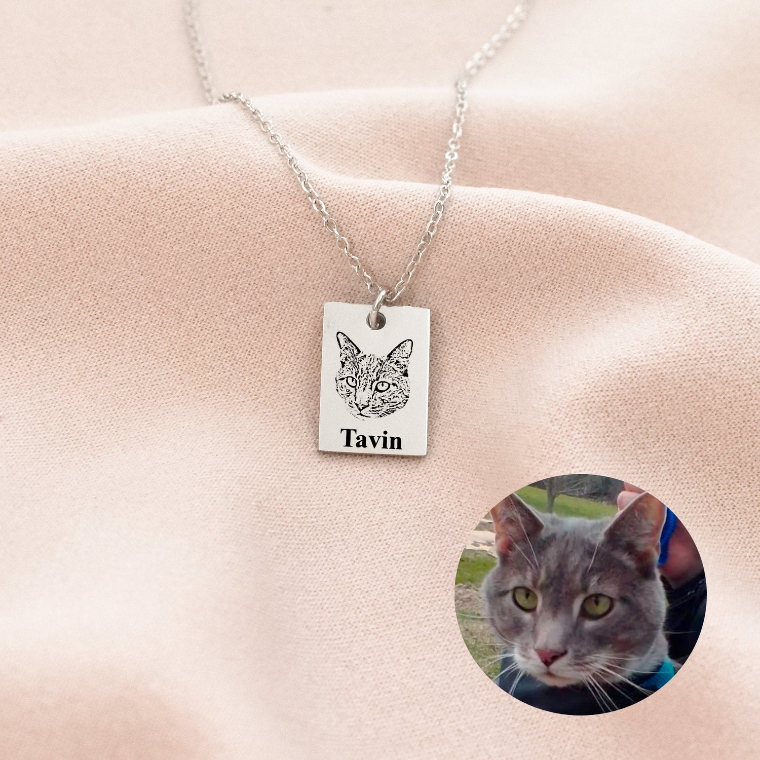 Why Pet Photo Keychains Are the Perfect Gift for Pet Lovers featuring a silver engraved cat pendant named Tavin on pink fabric