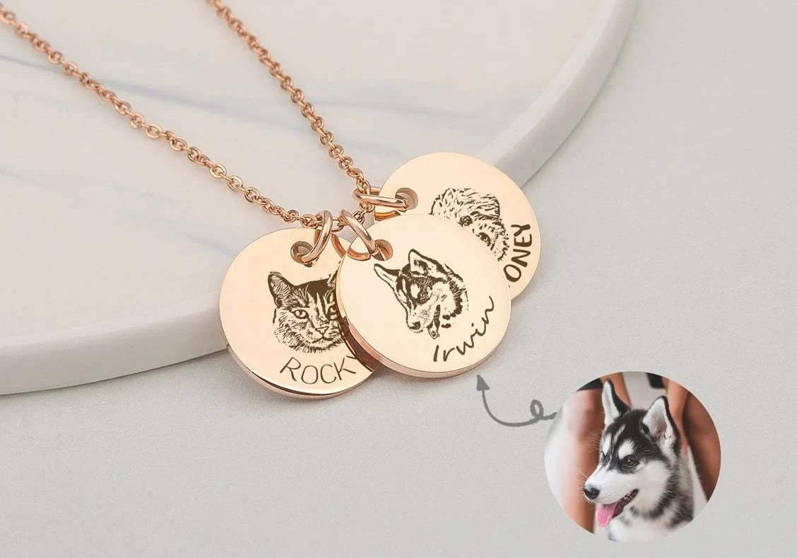 Custom Dog Necklaces featuring engraved tags with dog names and images in a stylish design