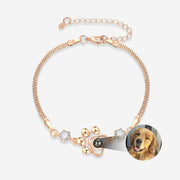 Rose gold Custom Pet Face Bracelet with paw charm and photo insert showing a golden retriever portrait