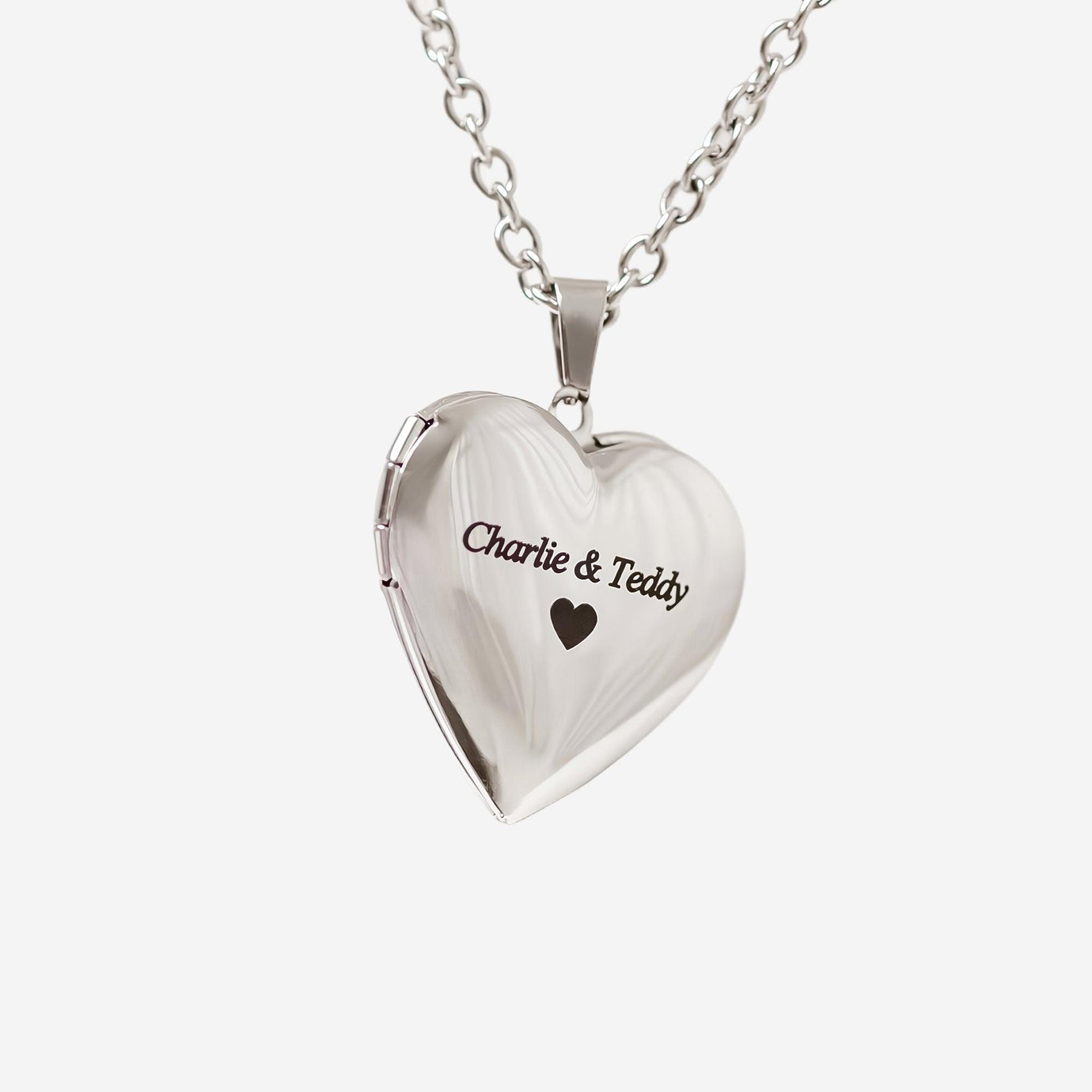 Heart-shaped pet locket necklace engraved with Charlie and Teddy showing what makes the pet locket necklace a cherished accessory