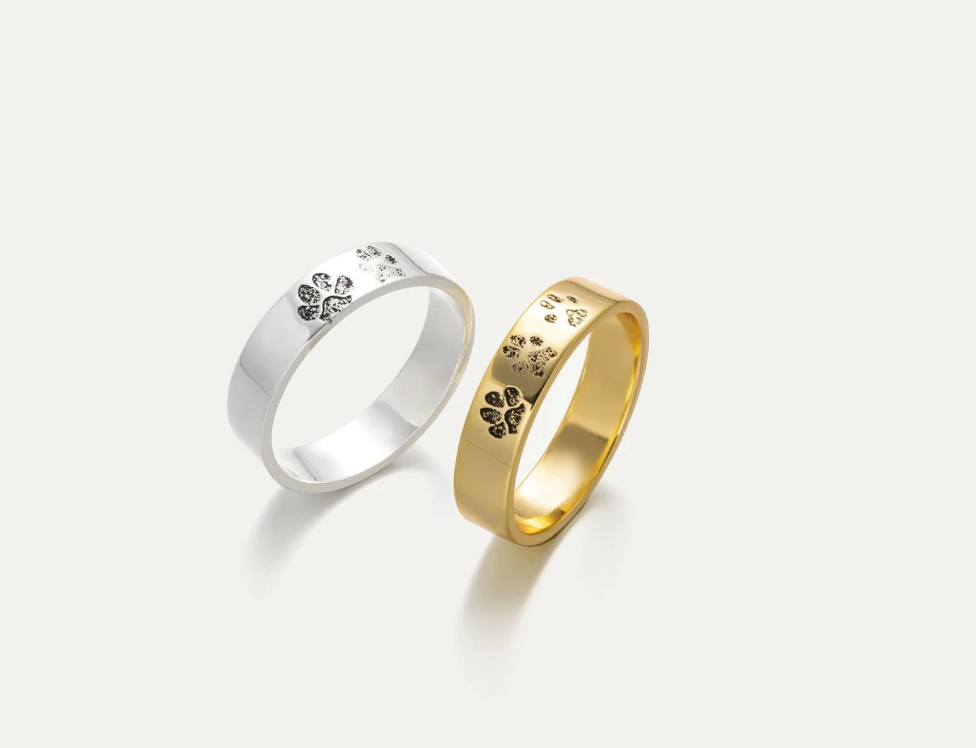 Elegant Pet Paw Ring Collection in Silver and Gold Featuring Unique Paw Print Designs