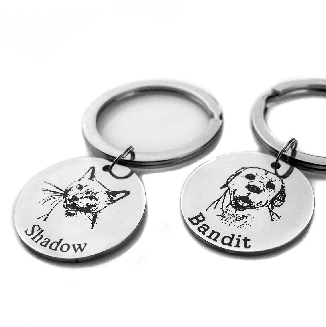 Personalized Pet Keychain featuring engraved portraits of beloved pets Shadow and Bandit